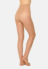Gennemsigtige beige strømpebukser med højtaljet design, glat tekstur og sømløs ryg. Materialet virker let og hudfarvet.