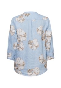 Hellbluse aus Leinen mit braunem Blumenmuster, Dreiviertelärmel, einer Rückenpasse und seitlichen Schlitzen am Saum.