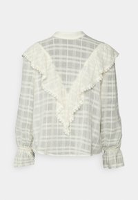 Blusa leve e xadrez em creme com design de costas franzidas. Apresenta mangas elásticas e pregueadas, além de delicados detalhes em renda.