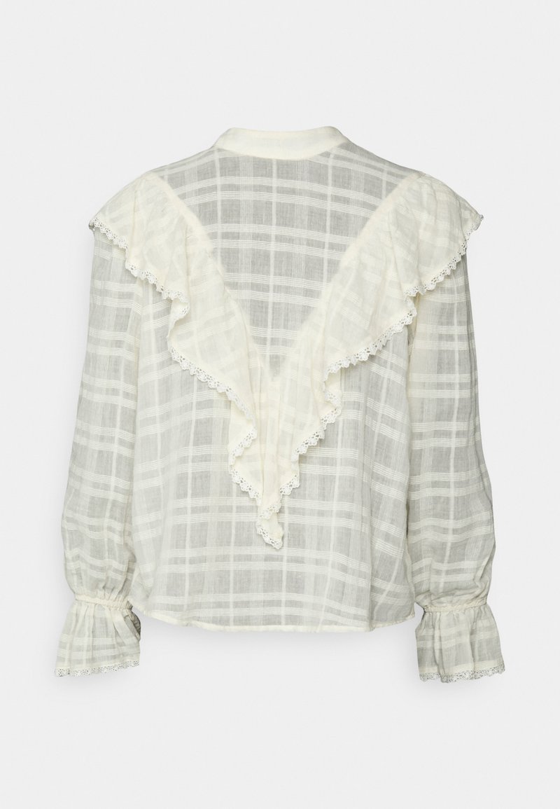 Blusa leve e xadrez em creme com design de costas franzidas. Apresenta mangas elásticas e pregueadas, além de delicados detalhes em renda.