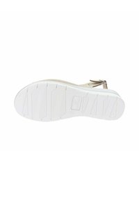 Suola in gomma bianca con motivo di presa testurizzato e segmenti sollevati. Presenta una tomaia beige chiaro con perforazioni e cinturino alla caviglia regolabile.