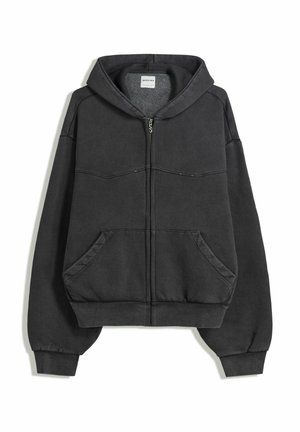 Zwarte zip-up hoodie gemaakt van zachte stof, met een gevoerde capuchon, voorzakken en elastische manchetten en zoom. Eenvoudig ontwerp met minimale stiknaden.