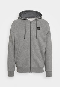 Felpa grigia con zip e texture morbida, dotata di cappuccio, maniche raglan, tasche frontali e un piccolo logo nero sul petto.