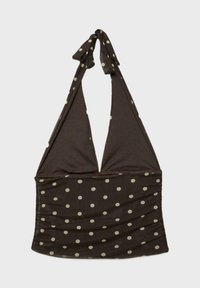 Brązowy top na ramiączkach z beżowymi kropkami, trójkątnymi miseczkami i wiązaniem na szyi, ułożony płasko na jasnym tle.