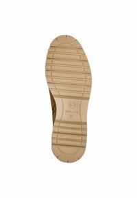 Semelle de chaussure marron clair avec une texture striée. Présente un logo circulaire et une taille de chaussure "37" en relief. Matériau lisse avec un motif de semelle clairement défini.