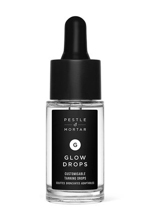 Klares Glasfläschchen mit schwarzem Tropfverschluss mit der Aufschrift „Pestle & Mortar Glow Drops“, anpassbare Bräunungstropfen in weißem Text auf schwarzem Hintergrund.
