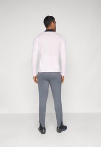Nike Performance STRIKE PANT - Joggebukse - iron grey/black/sunset pulse