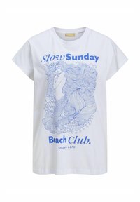 Bílý bavlněný tričko s modrým obrysovým ilustrací mořské panny a textem: "Pomalý nedělní plážový klub. OCEÁNSKÝ ŽIVOT." Krátké rukávy, volný střih.