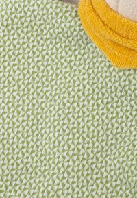 Plush textile in pale green with a triangular pattern, accented by a soft yellow detail. Features a textured surface for tactile appeal.
