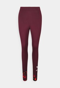 Burgundy leggings made of stretch fabric, featuring a colorful floral pattern at the ankles and a logo near the lower leg.
