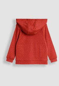 Felpa rossa con cappuccio, caratterizzata da un motivo puntinato a rilievo, maniche lunghe e tasca a marsupio. Tessuto morbido con polsini e orlo a coste.
