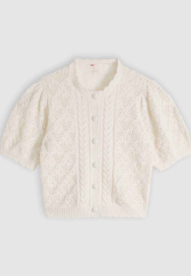 White short-sleeve knit cardigan with diamond and cable patterns, button front, and ruffled round neckline.