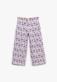 Bredde bukser lavet af let stof med et lilla og teal zigzag mønster på en cremefarvet baggrund. Elastisk talje øverst.