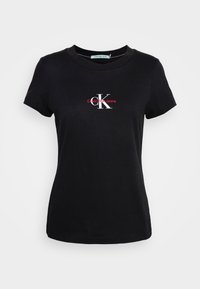 Černé bavlněné tričko s kulatým výstřihem a krátkými rukávy, na přední straně s vytištěným logem Calvin Klein Jeans v bílé a červené barvě.