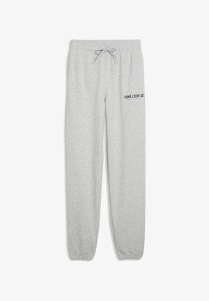 Světle šedé tepláky z měkké bavlněné směsi. Mají elastický pas se stahovací šňůrkou a potisk loga na levém stehně.