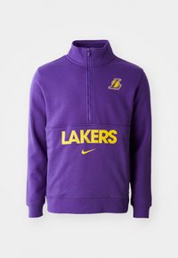 Sweatshirt violet avec un col montant, présentant le texte et le logo "LAKERS" en jaune. Fabriqué en matériau doux avec une fermeture éclair à l'avant et des poignets côtelés.