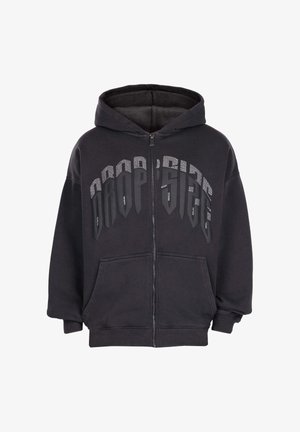 Sweat à capuche zippé noir avec poches avant et grand texte "DROP'SIDE" en polices mélangées sur la poitrine.