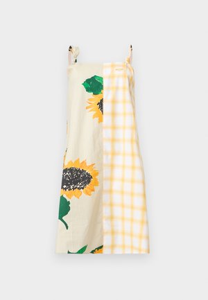Φόρεμα χωρίς μανίκια με λεπτές τιράντες, με σχέδιο διαχωρισμού μεγάλων ηλιοτρόπιων σε κρεμ και κίτρινο καρό μοτίβο.