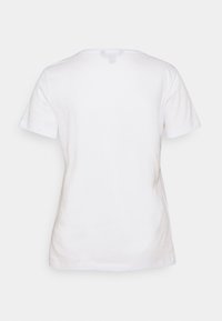 Vit kortärmad t-shirt, i bomull, med klassisk rundhalsdesign, slät textur, inga synliga mönster eller hårdvarudetaljer.