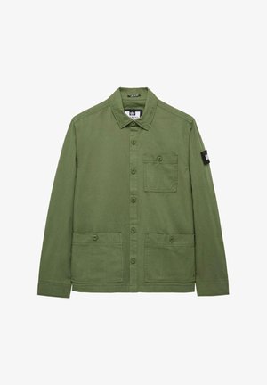 Zielona bawełniana kurtka z zapinaniem na guziki, ze spiczastym kołnierzem, dwoma dużymi kieszeniami z przodu i małą naszywką na rękawie. Gładka struktura.
