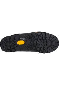 Sort gummisål med tekstureret dækmønster, Vibram-mærkning og gule accenter; designet til greb og holdbarhed.