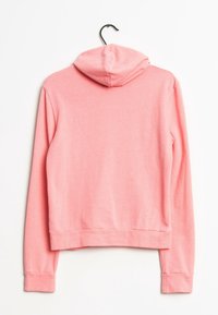 Pink cotton hoodie with a flat hood and long sleeves, featuring a ribbed hem and cuffs. The fabric has a smooth texture.