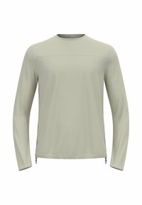 Lichtgrijze longsleeve shirt gemaakt van zachte, lichte stof. Kenmerkt zich door een ronde halslijn en zijritsen voor een verstelbare pasvorm.