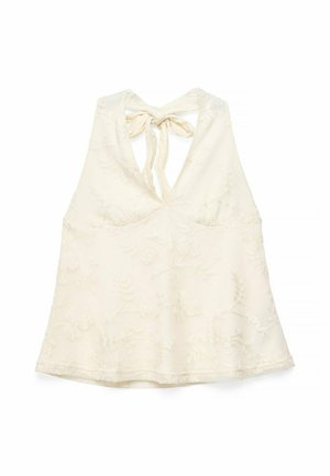 Cream lace halter top with floral embroidery and a back tie closure, featuring a deep V-neck design.