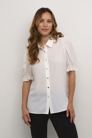 White button-up blouse made of lightweight fabric with short puffed sleeves, lace trim, and decorative buttons along the front.