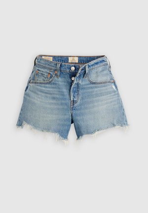 Light blue high-waist denim shorts with frayed hems, button fly, and front pockets on a plain light background.