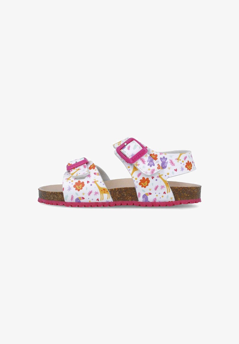 Sandalias blancas con estampado floral y de animales, hebillas ajustables rosas, plantilla de corcho y suela texturizada rosa.