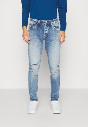 Jeans Tapered Fit - light-blue denim