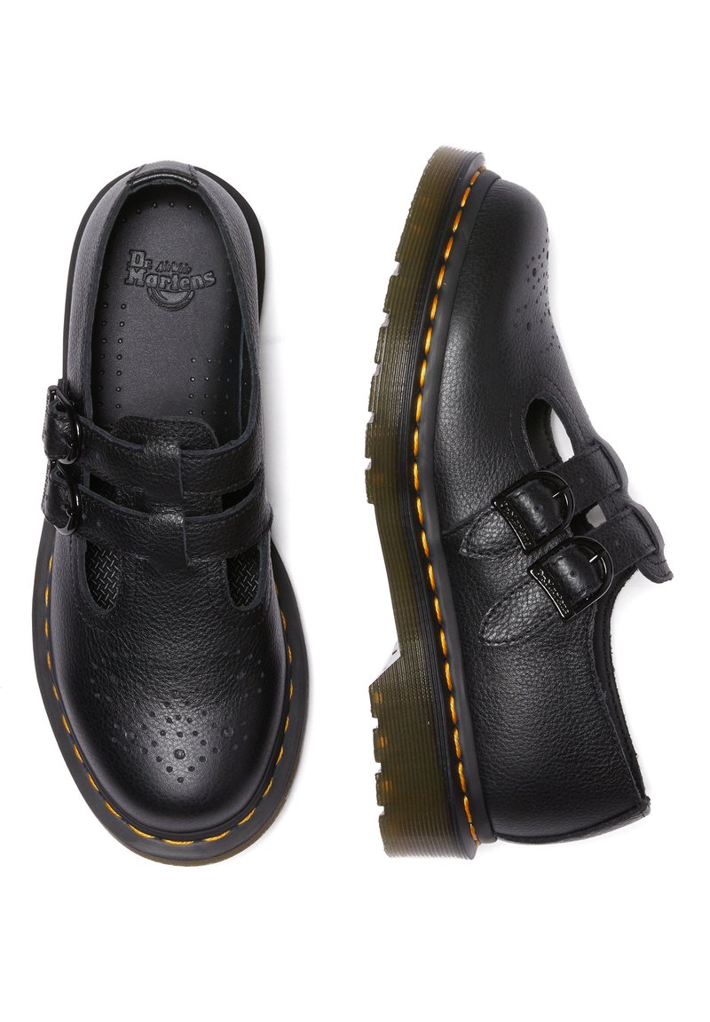 Schwarze Leder Schuhe mit doppelten Schnallen, durchbrochenem Design und gelben Nähten. Dicke, strukturierte Gummisohle mit einem leichten Absatz.