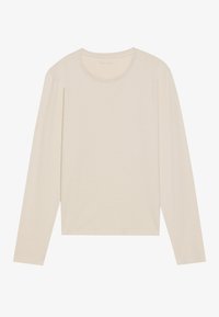 Långärmad tröja med rund hals i en ljus beige färg. Tillverkad av mjukt tyg med en slät textur. Har en avslappnad passform och enkel design.