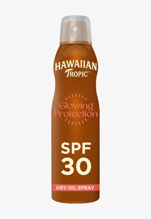 Protector solar en spray de aceite seco Hawaiian Tropic Glowing Protection SPF 30 en un bote marrón con tapa de spray transparente.