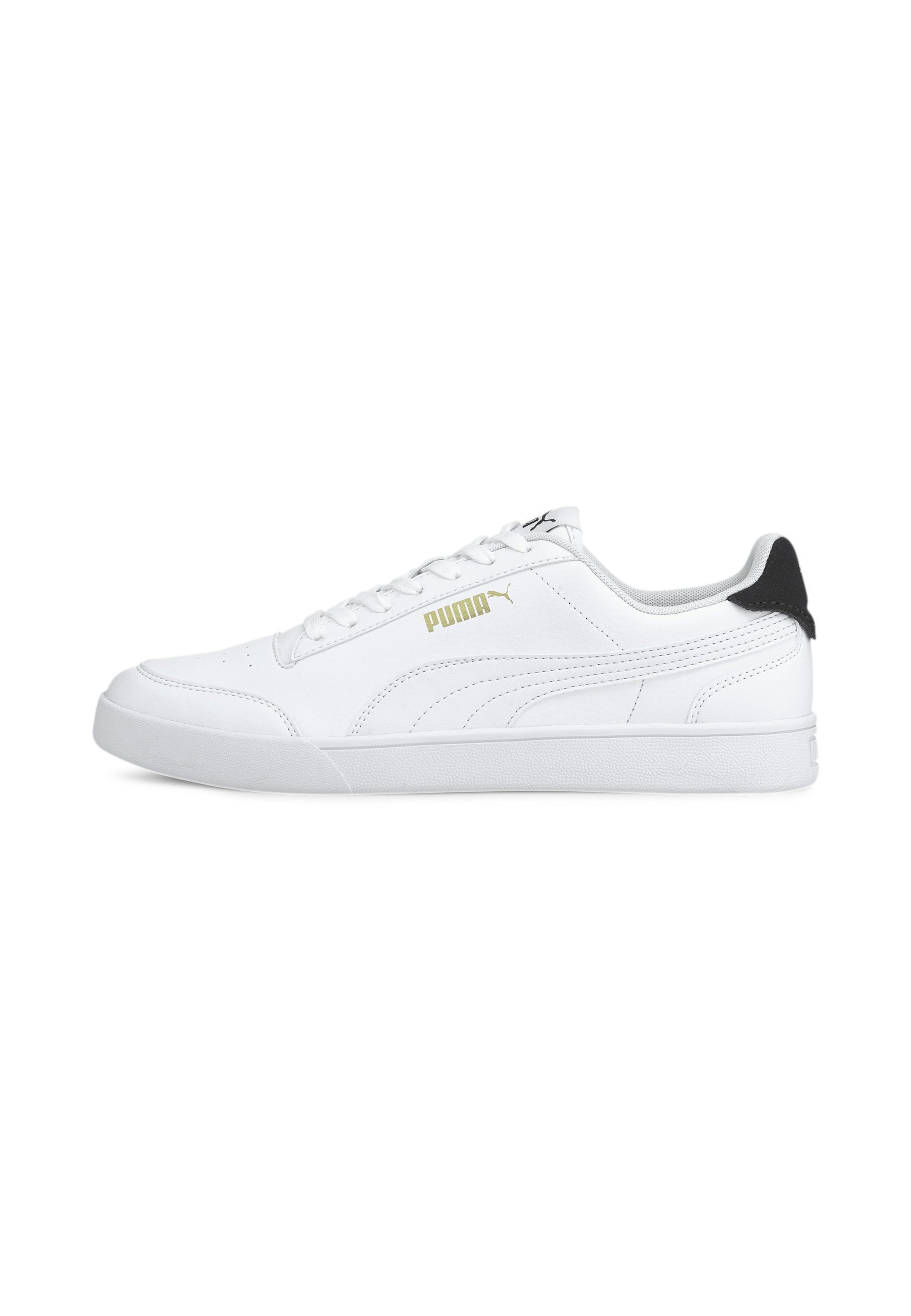white and gold puma trainers