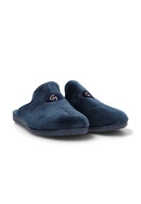 Zapatillas de color azul marino hechas de un suave y acogedor tejido, con un diseño de apertura redondeada en la parte trasera, presentan un diseño bordado y un pequeño logo en la parte frontal.