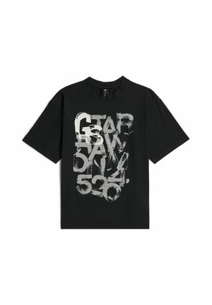 T-shirt noir à manches courtes avec texte graphique blanc usé indiquant "G-STAR RAW 530" sur le devant.