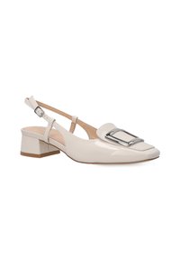 Beige patent leather slingback shoe with a square toe, silver hardware accent, and a low block heel, featuring a cut-out design on the side.