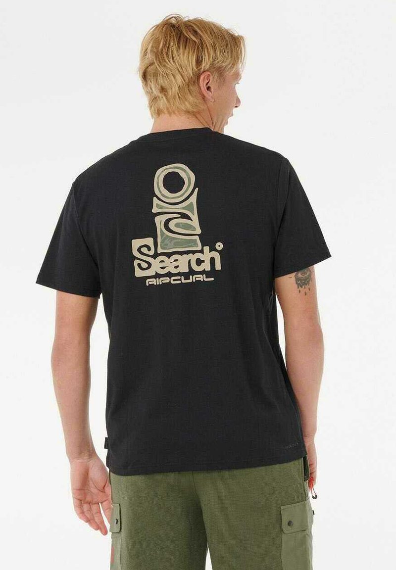 Sort bomulds t-shirt med et stort kreme- og grøn grafiklogo på ryggen. Korte ærmer, rund hals, løs pasform.