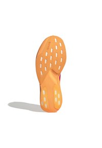 Orange outsole with white traction dots and grooves, featuring a slightly curved shape. "Continental" logo embossed on the surface.