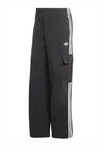 Svarta cargobyxor med vita sidoränder, elastisk midja och en sidoficka. Gjorda av ett lätt, texturerat material.