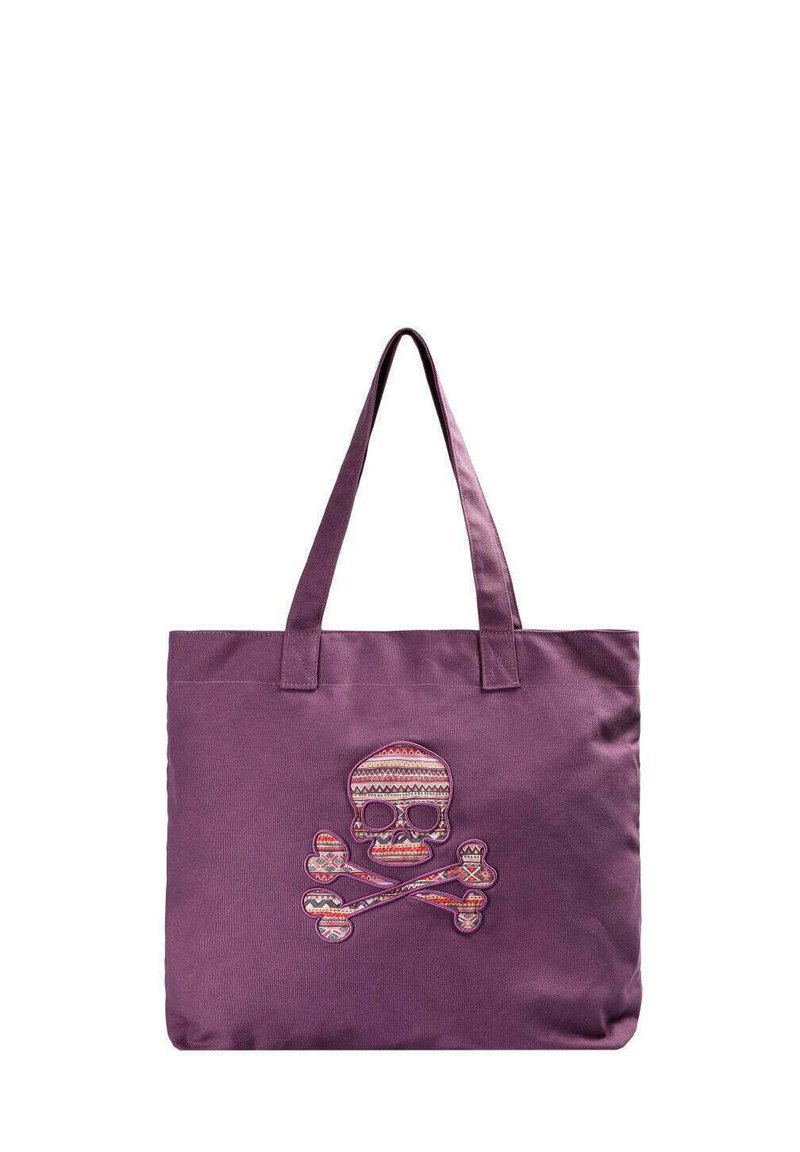 Bolsa de lona morada con un gran diseño bordado de calavera y tibias cruzadas, que presenta patrones coloridos y asas para el hombro resistentes.