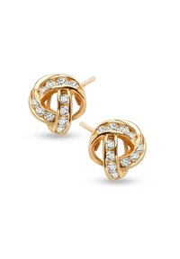 Złote kolczyki w formie węzła z przejrzystymi cyrkoniami wzdłuż krzywizn. Okrągłe zapięcia typu post i gładka, polerowana powierzchnia.