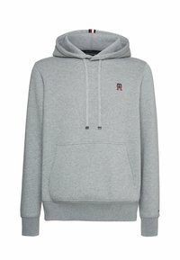 Felpa grigia realizzata in morbido materiale, con tasca frontale, cordoncini regolabili e un piccolo logo ricamato. Polsini e fondo a costine.