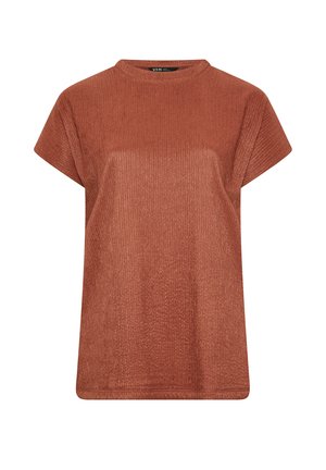 Top de manga corta en color óxido con cuello redondo y tejido de punto texturizado. Corte holgado con un corte recto y un detalle mínimo.