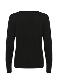 Maglione nero a maniche lunghe, realizzato in un morbido tessuto lavorato a maglia, presenta un collo a giro, polsini a costine e una vestibilità leggermente svasata in vita.
