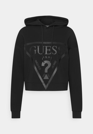 Czarna krótka bluza z kapturem, długimi rękawami i dużym błyszczącym logo Guess z znakiem zapytania z przodu.