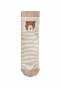 Beige bomuldsstrømper med lysebrune vandrette striber. Har et brunt bjørneansigt designet foran, solid beige manchet og tå.