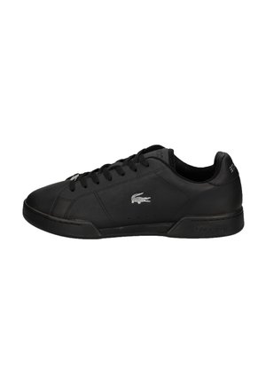 Black leather sneaker with textile accents, round toe, rubber sole, and lace-up closure. Features a silver logo on the outer side.